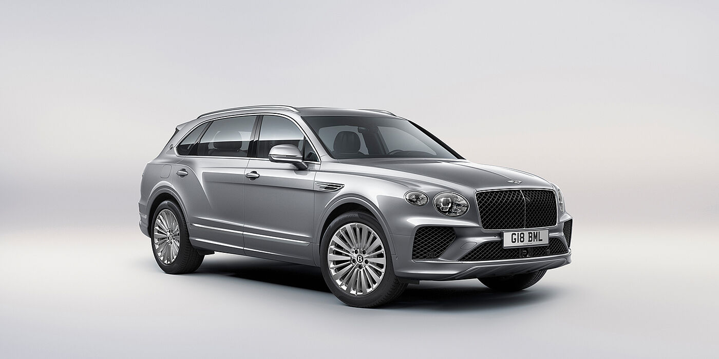 Bentley Surrey Bentley Bentayga Extended Wheelbase luxury SUV front three quarter view in Moonbeam paint with 21 inch five spoke painted wheels