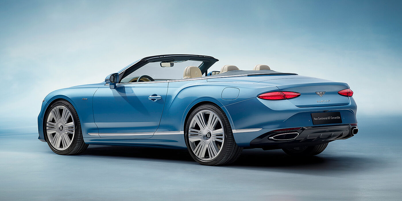 Bentley Surrey New Bentley Continental GTC Azure convertible rear view in Light Windsor blue paint with 22 inch ten spoke wheels and chrome exterior details