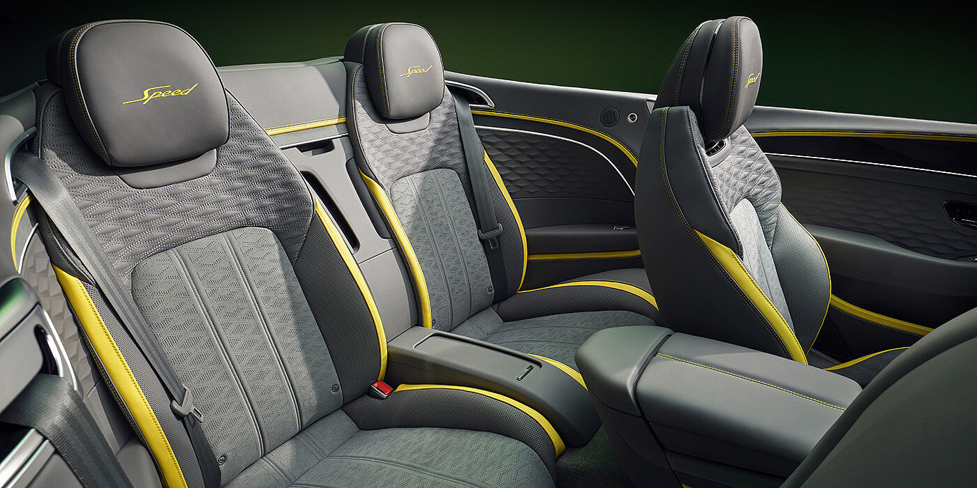 Bentley Surrey Bentley New Continental GTC Speed convertible rear interior with unique Speed colour split in Gravity Grey and Cyber Yellow hide colours, and contrast stitched headrest emblems 