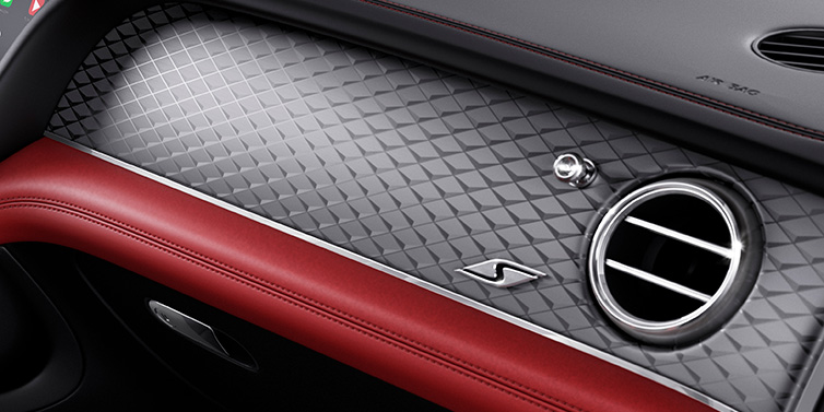 Bentley Surrey Bentley Bentayga S SUV front interior dash with Dark Tint Diamond Brushed Aluminium veneer and S badge surrounded by Hotspur red and Beluga black hide