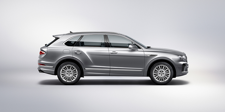 Bentley Surrey Bentley Bentayga SUV side profile in Moonbeam silver paint against white background featuring 21 inch 5 spoke wheels
