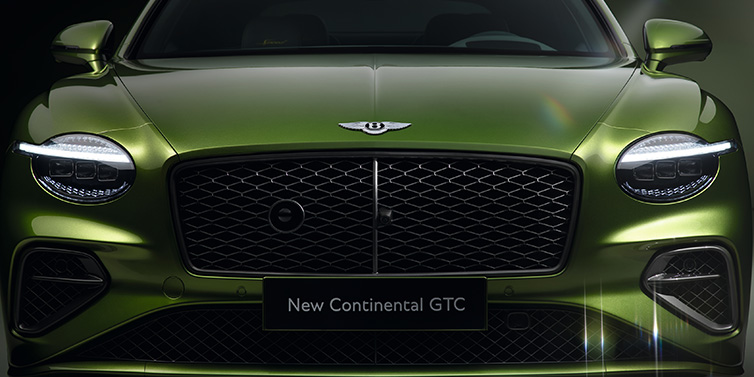 Bentley Surrey Bentley Continental GTC Speed convertible front bonnet detail in Tourmaline Green paint showing new light design