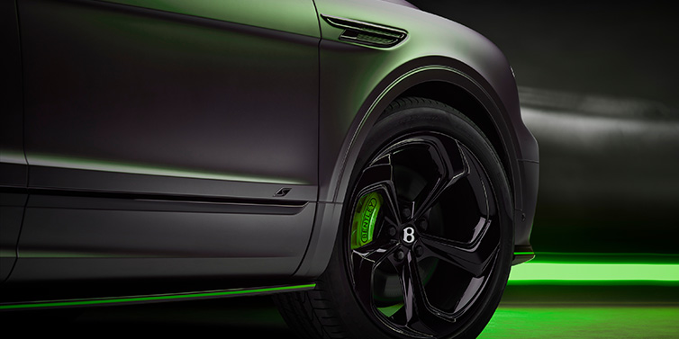 Bentley Surrey Bentley Bentayga S Black Edition SUV exterior wheel detail with Cyber Green brakes with Anthracite Satin paint