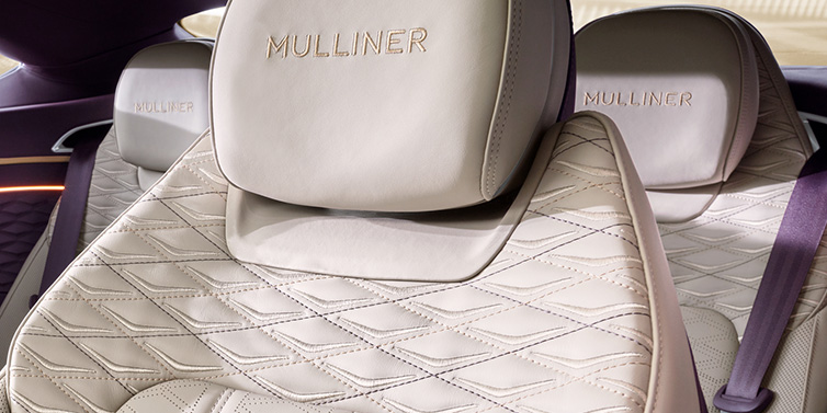 Bentley Surrey Bentley Continental GT Mulliner coupe seat detail in Linen leather with Mulliner Diamond in Diamond quilting and Mulliner embroidered seat emblem